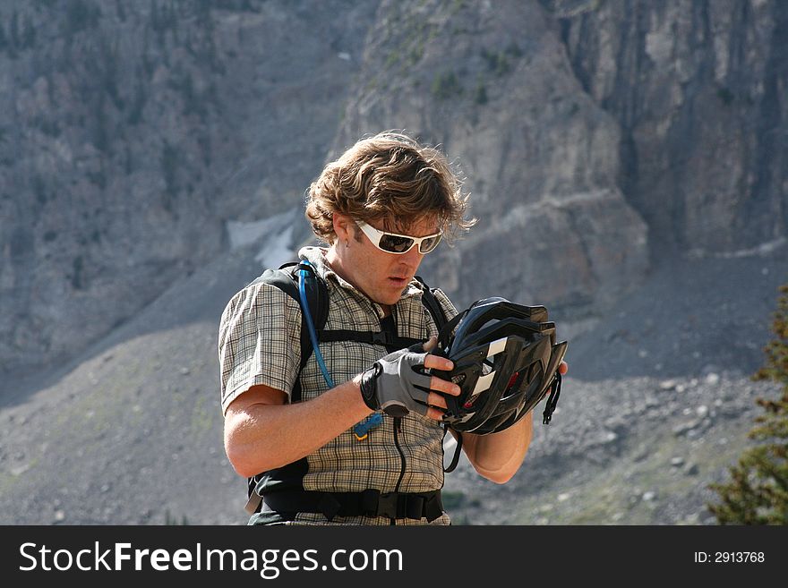 Biker Checks Helmet