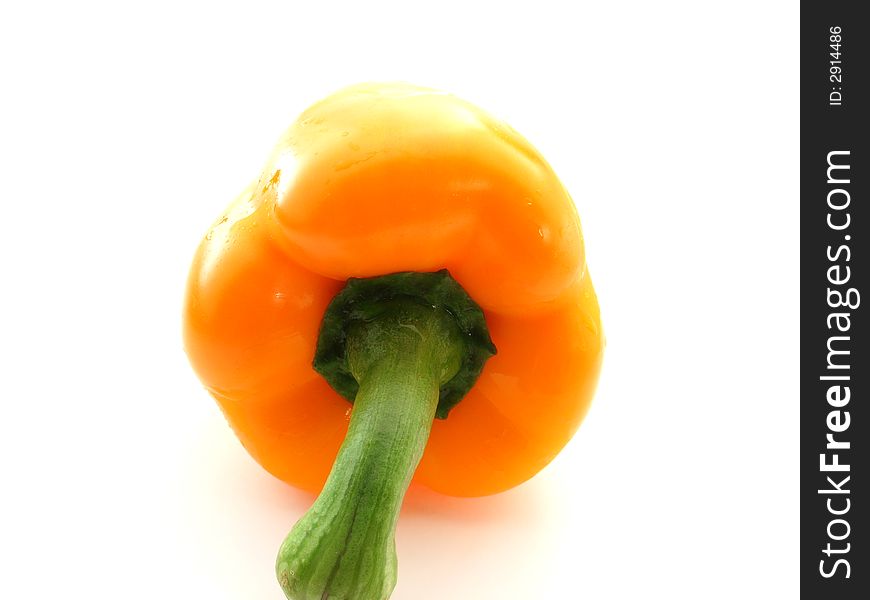 Sweet ripe orange pepper on white background