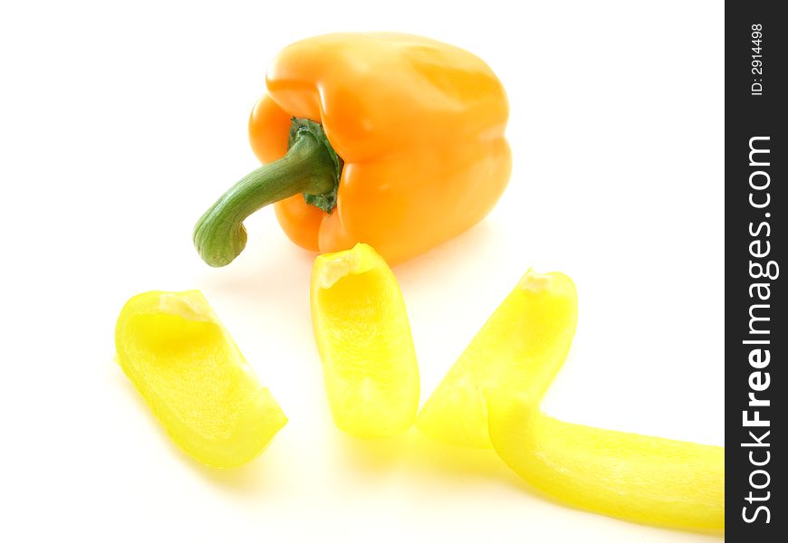 Sectioned yellow pepper and orange pepper on white background