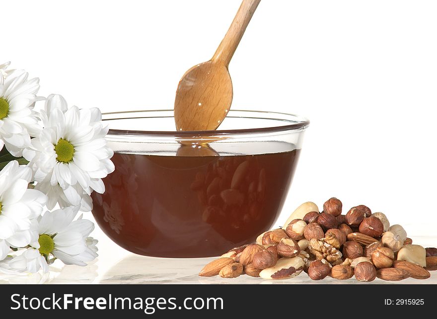 An image of flowers, nuts and honey. An image of flowers, nuts and honey