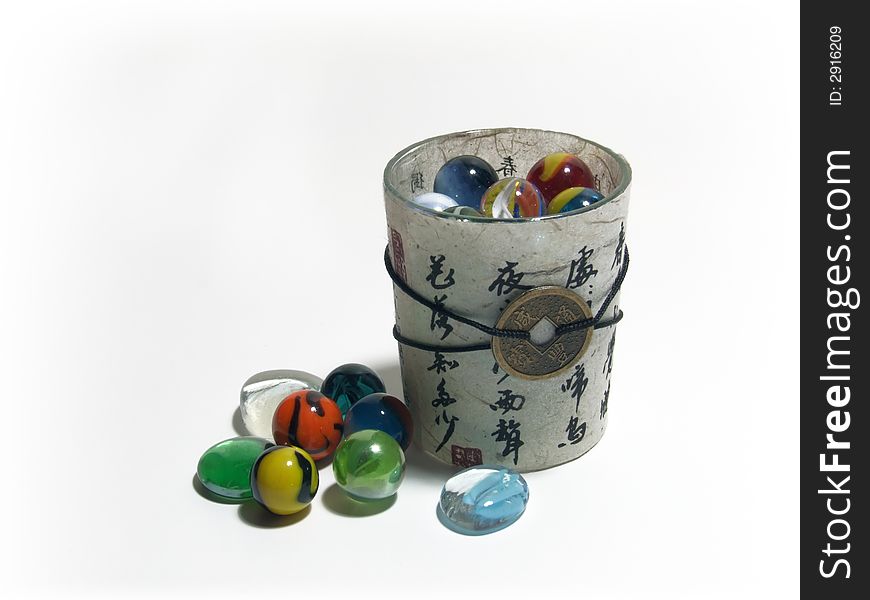 Chinese candlestick with hieroglyphs and glass balls isolated