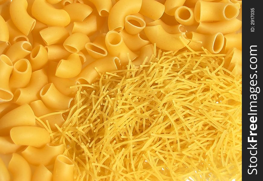 Macro of uncooked macaroni pasta background