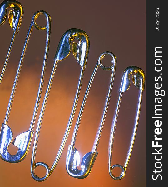 Silvery pins on a brown background