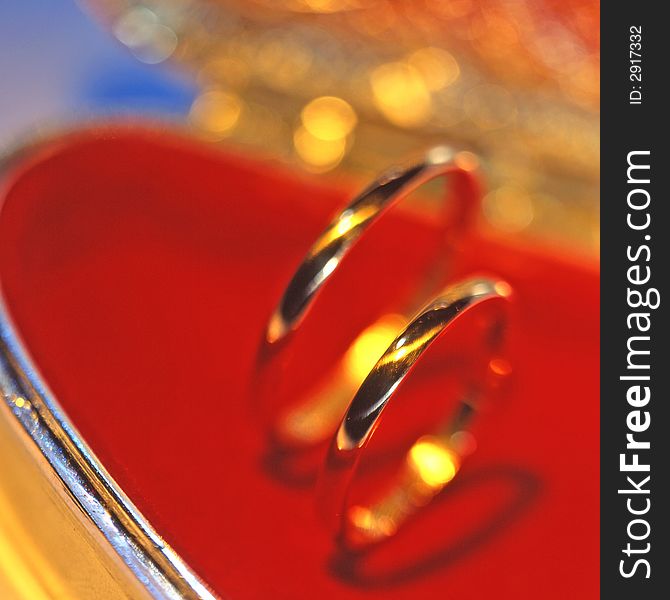 Wedding rings on a red background