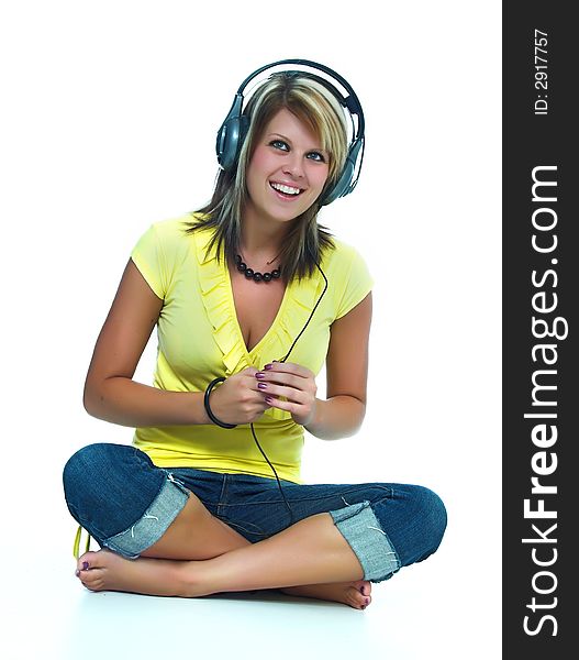 Young girl sitting and hear music
