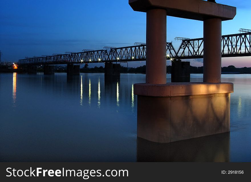 Night view on the bridge with illuminated light and reflection water