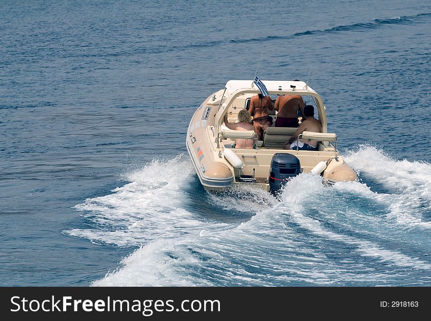 Group of people cruising on a small boat. Group of people cruising on a small boat