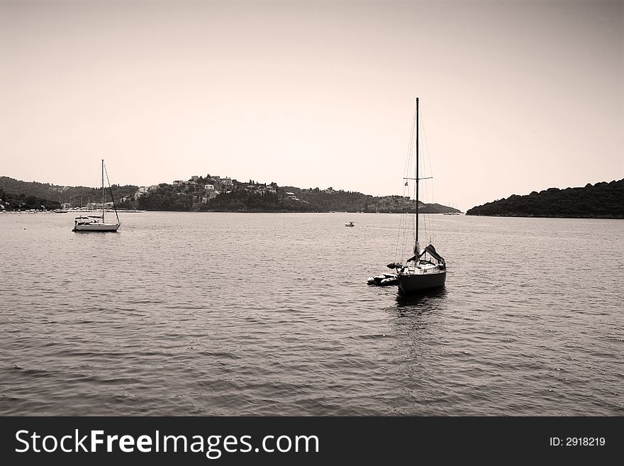 Calm sea view in greek island with two small boats