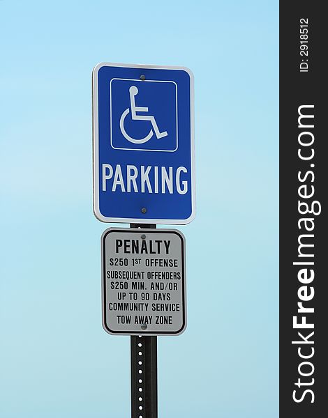 Handicapped Parking sign against a blue sky