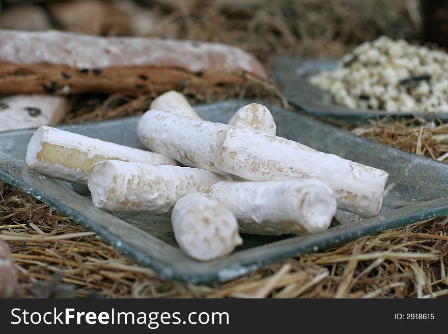 Bread and cheese display on straw