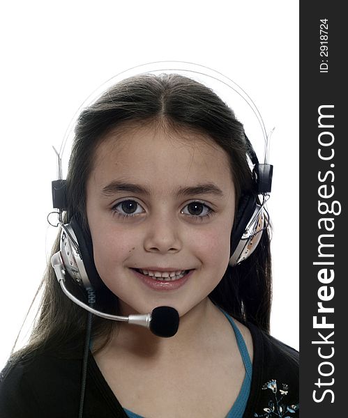 Young girl with headphones smiling at camera