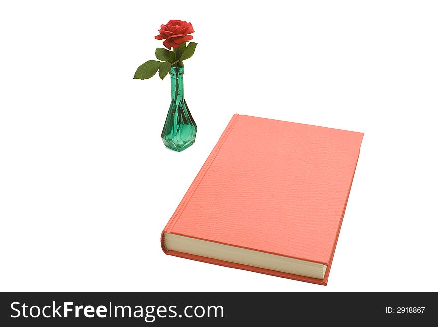 A red book and a rose in a green bottle isolated on white. A red book and a rose in a green bottle isolated on white