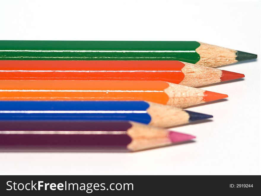 Set of aligned crayons isolated over a white background. Set of aligned crayons isolated over a white background.