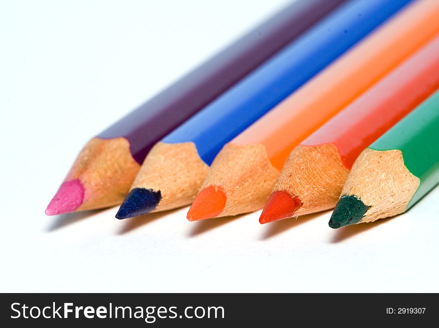 Set of aligned crayons isolated over a white background. Set of aligned crayons isolated over a white background.