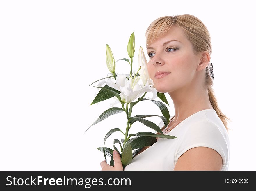 The attractive girl holds a liliy in hands. The attractive girl holds a liliy in hands