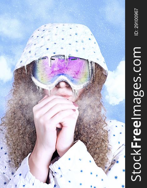 Girl in glasses for snowboarding, warm hands. Girl in glasses for snowboarding, warm hands