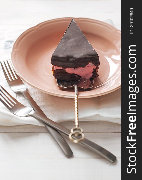 Piece of Chocolate Cake with Pink Yogurt Cream