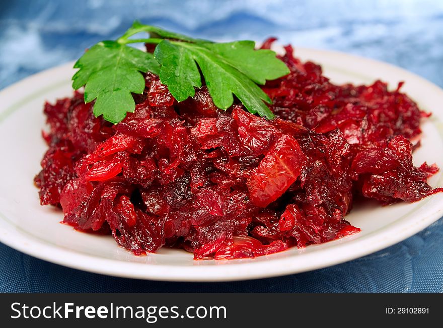 Juicy grated, roasted beet on the plate