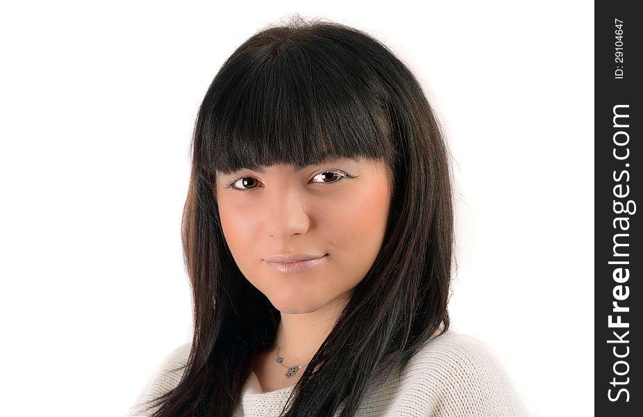 Portrait of a young brunette in studio on white background