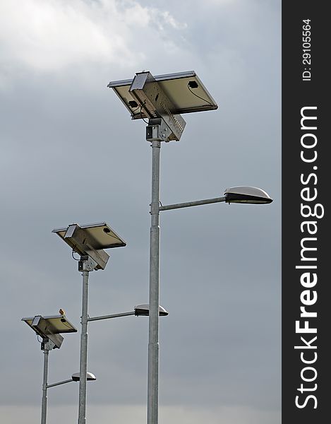 Series of street lamps powered by solar panels. Series of street lamps powered by solar panels