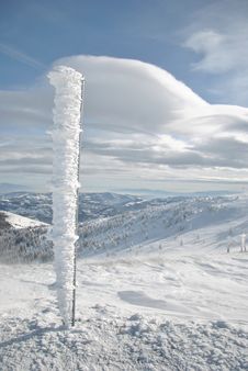 Iron Pillar On Snowy Mountain Royalty Free Stock Photography