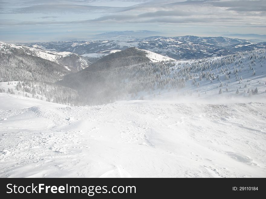 Winter landscape, windy day on the mountain