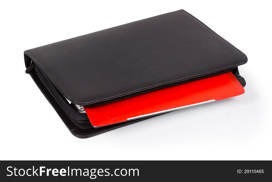 Black leather diary with a colourful red tab for organizing and scheduling your time or taking notes  on white