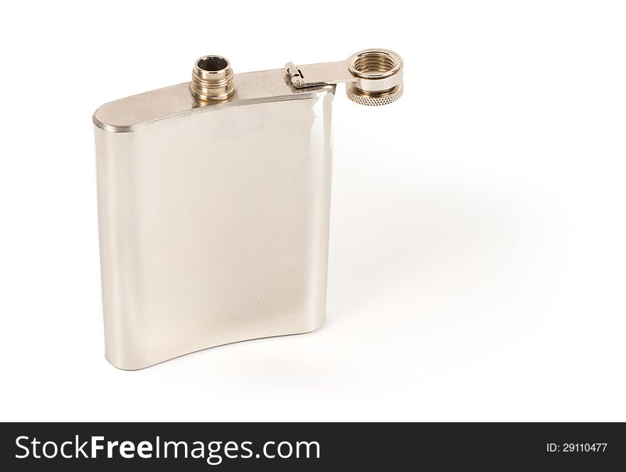 Concave traditional silver metallic hip flask for carrying a nip of brandy or spirits in your pocket  on white with copyspace. Concave traditional silver metallic hip flask for carrying a nip of brandy or spirits in your pocket  on white with copyspace