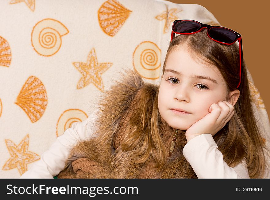 Young Girl With Sunglasses On Her Head