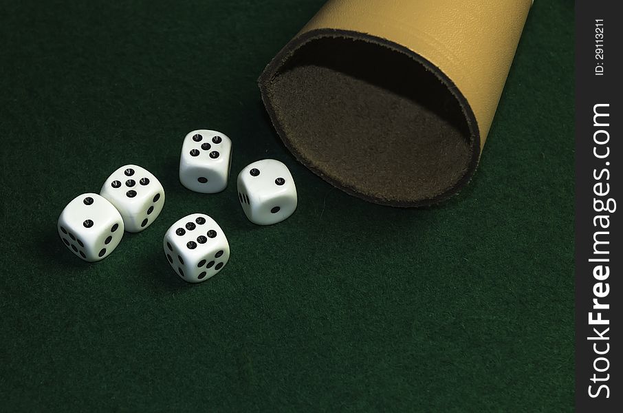 Basic set for the game of Craps on a green material. Basic set for the game of Craps on a green material