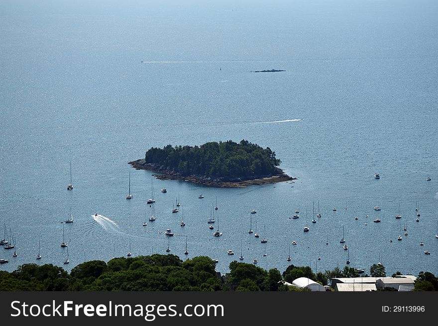 Mountain top view of many sailboats in a safe harbor on the Maine coast. Mountain top view of many sailboats in a safe harbor on the Maine coast