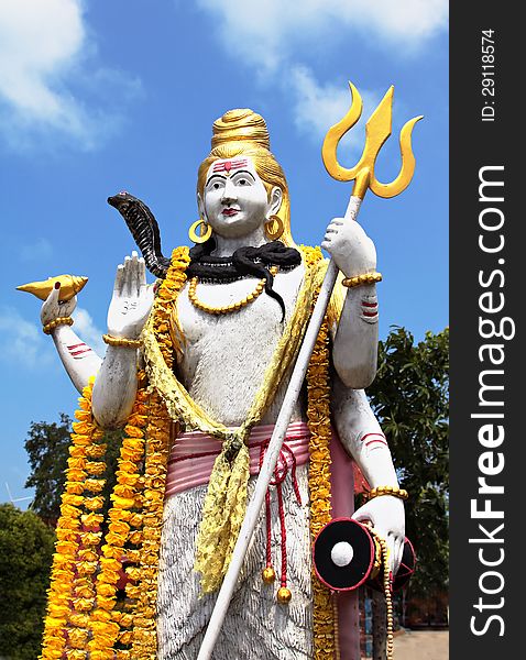 Lord Shiva statue on blue sky background