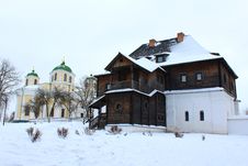 The Wooden House And Beautiful Church In Winter Stock Photo