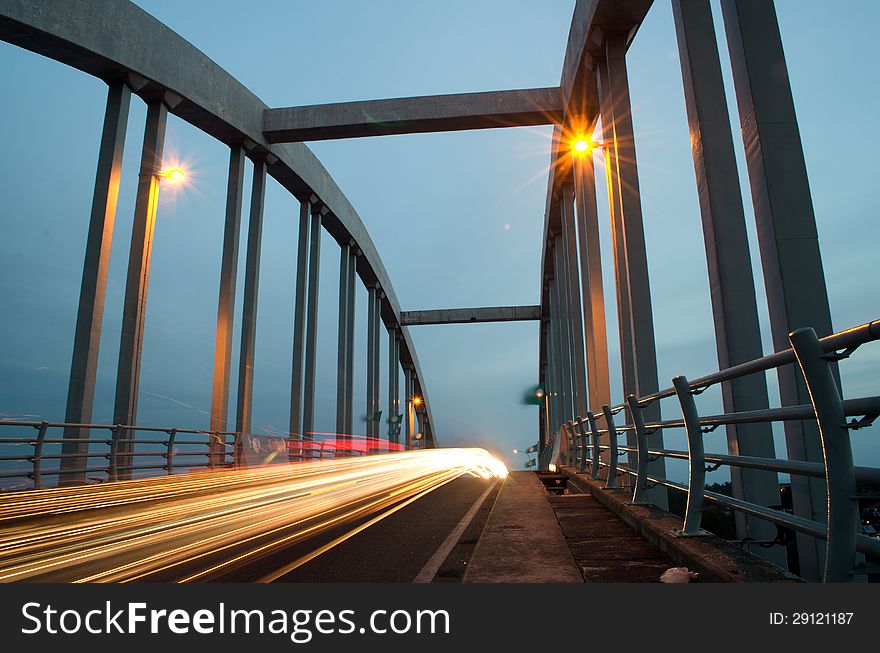 Light trails at kuala Kedah Bridge captured at dusk.