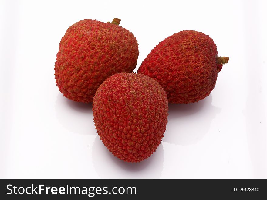 Fresh lychees on white background