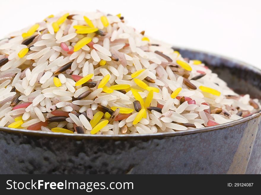 Raw Jasmine rice in black bowl. Raw Jasmine rice in black bowl.