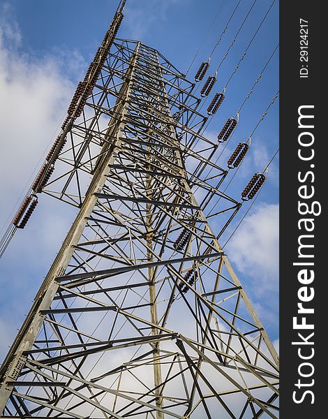 A high- voltage tower with blue sky. A high- voltage tower with blue sky