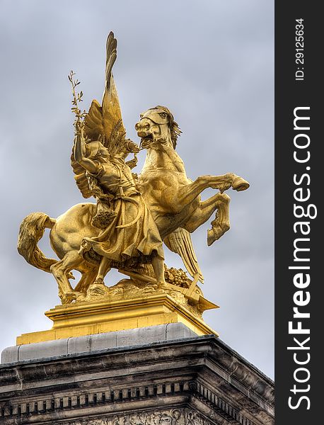 Golden statue on Pont Alexandre Bridge, Paris, France