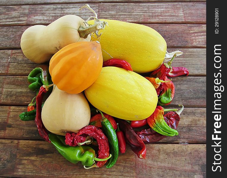 Still life of recently harvested squash and hot peppers. Still life of recently harvested squash and hot peppers.