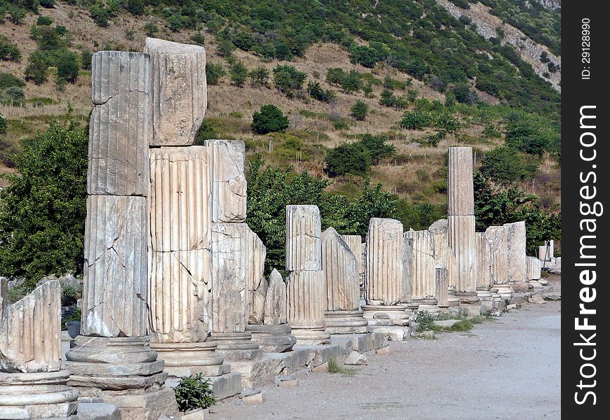 View of the ruins of columns lining an ancient street in Ephesus, Turkey.