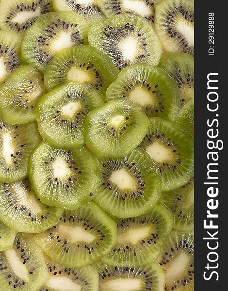 Green sliced kiwi fruit background