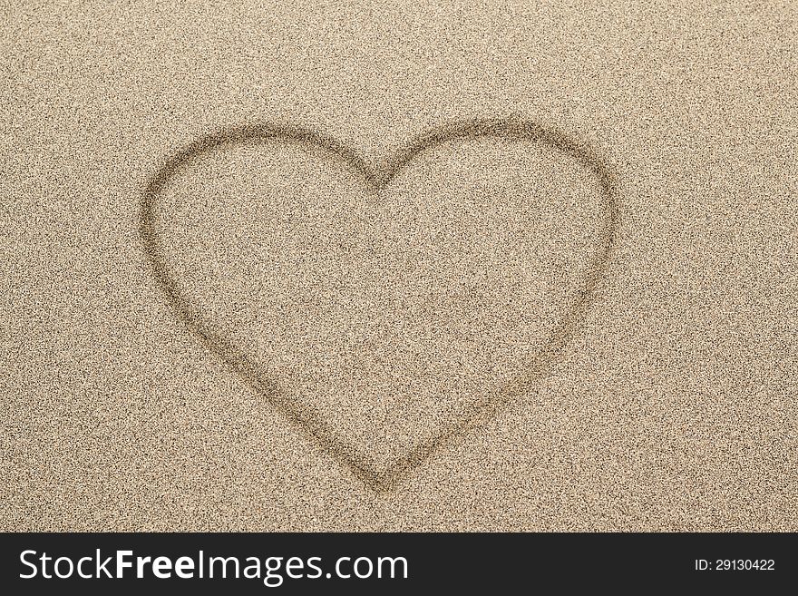 Heart Shape Symbol Drawn In Sand