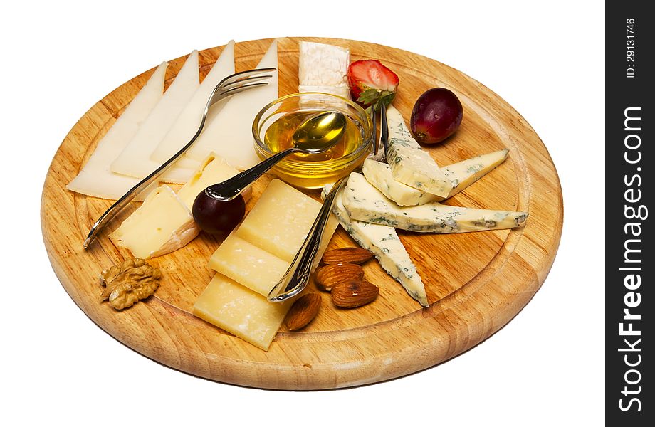 Cheese plate with honey on restaurant table. Cheese plate with honey on restaurant table