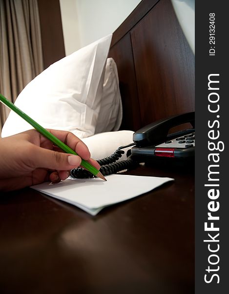Businessman Writing With Pencil