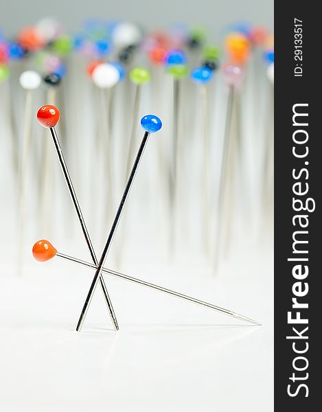 Different colored pins standing with background