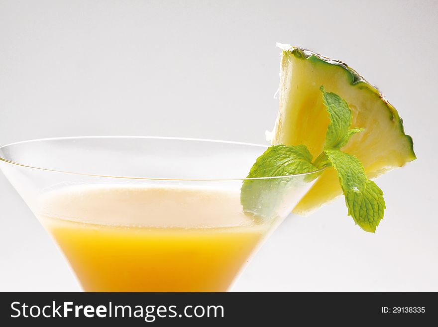 Fresh slice pineapple and juice on white background