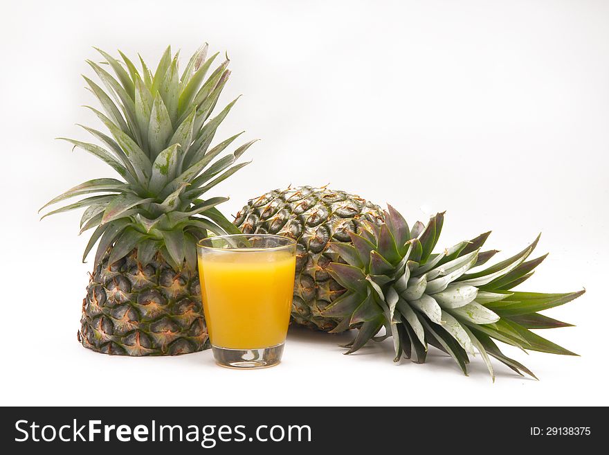 Pineapple with juice in white background. Pineapple with juice in white background.