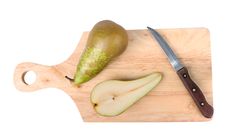 Pear, Knife And Chopping Board Stock Photography