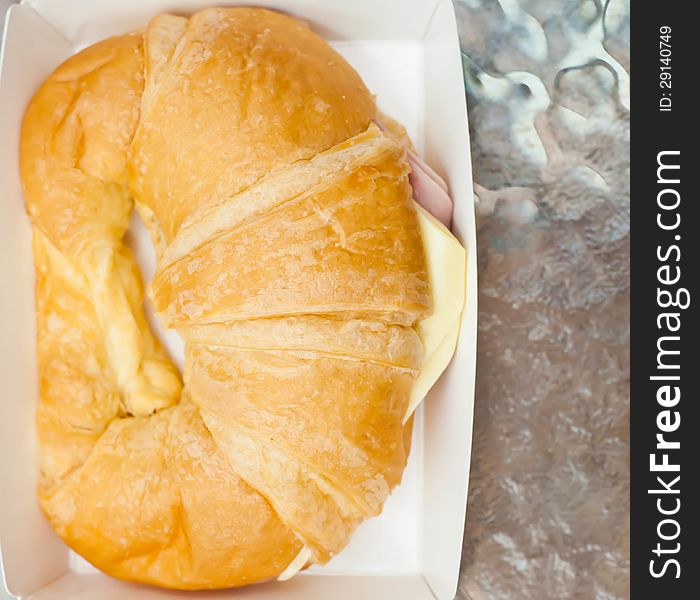 Ham cheese croissant placed on the table. Ham cheese croissant placed on the table.