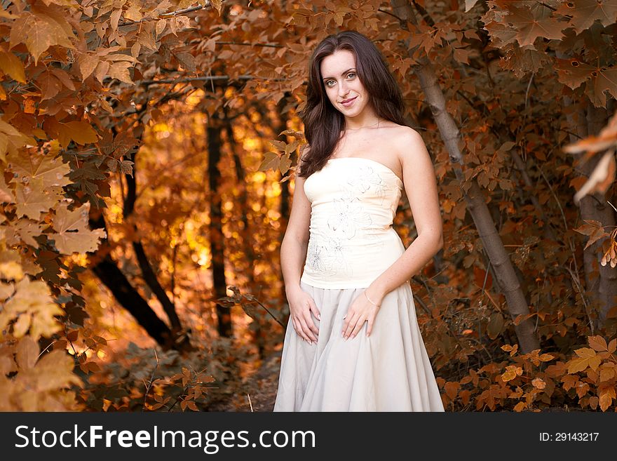 Portrait of young girl in autumn park
